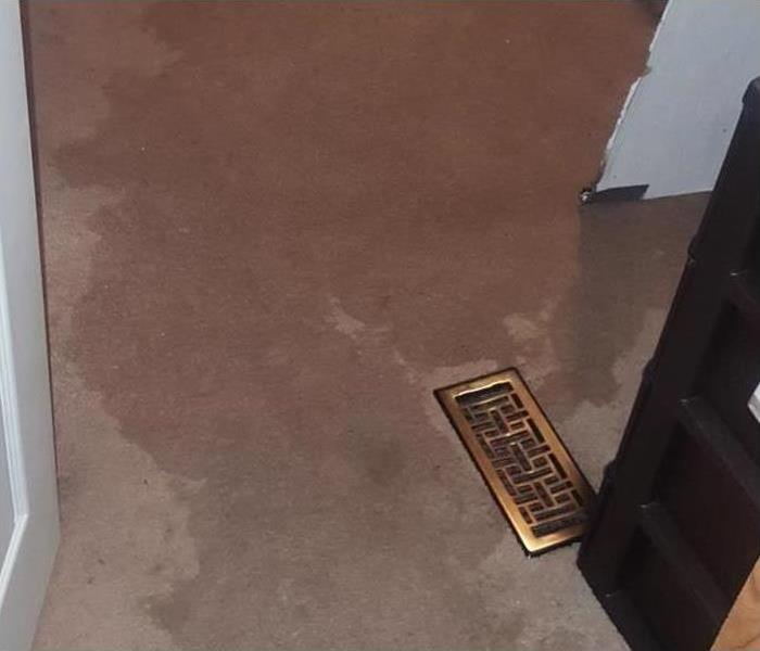 A soaked carpet after a water damage disaster