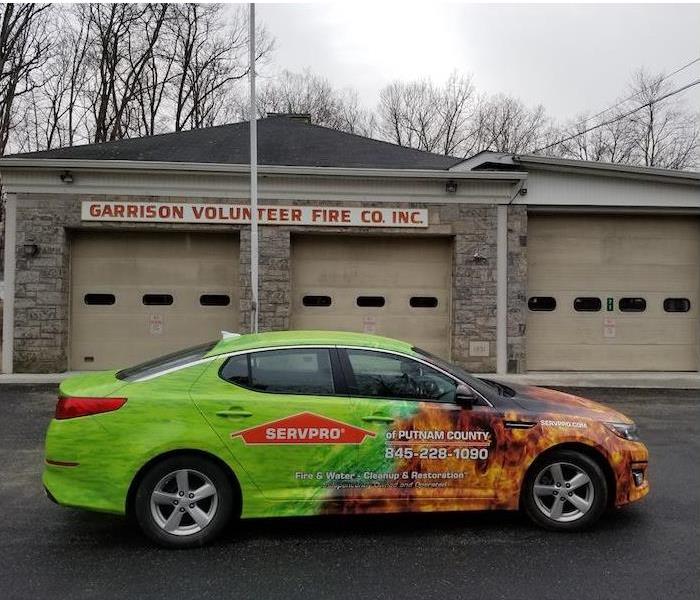 SERVPRO Car in front of a firehouse