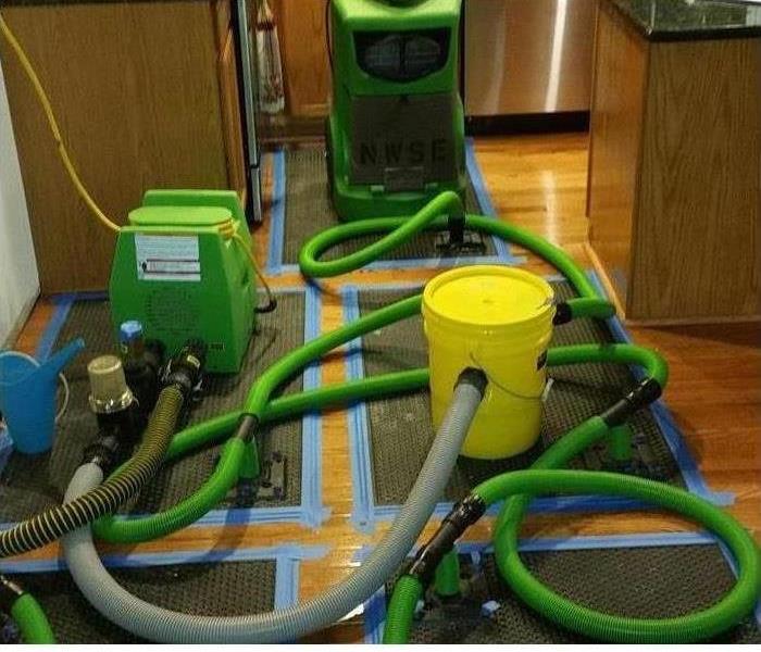 SERVPRO restoration equipment being used on water damaged kitchen