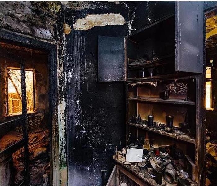 heavily fire damaged kitchen