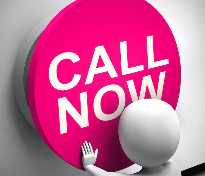 Image of figure pushing a button that says "Call Now"